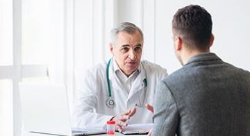 a man at a specialist's appointment